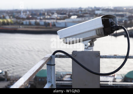 Closed-circuit television camera mounted on a rooftop of a port building in Hamburg harbor, Germany Stock Photo