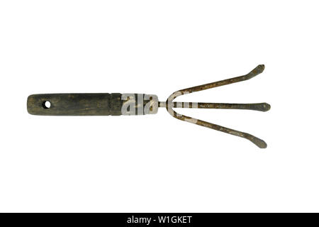 Very old and rusty tine curved fork for agriculture work isolated on white background Stock Photo