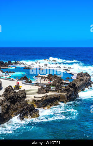 Natural volcanic swimming lagoon pools at Porto Moniz, travel destination for vacation, Madeira island, Portugal Stock Photo