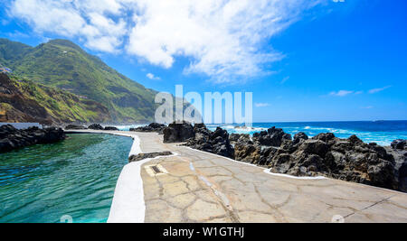 Natural volcanic swimming lagoon pools at Porto Moniz, travel destination for vacation, Madeira island, Portugal Stock Photo