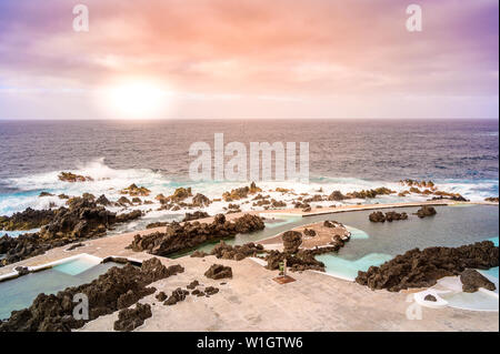 Natural volcanic swimming lagoon pools at Porto Moniz, travel destination for vacation, Madeira island, Portugal Stock Photo