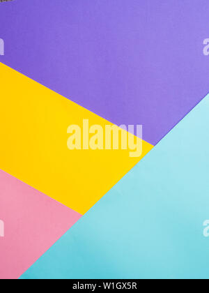 Colorful colored paper background. Multicolor blue, yellow, pink, lilac background. Copy space for text. Abstract pattern can use for design, wallpaper Stock Photo