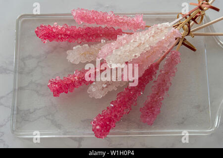 Cristalized lollipop with vibrant colors on a glass plate Stock Photo