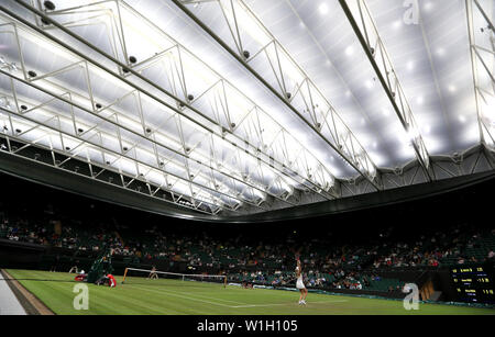 The new roof on court number one is closed during the Donna Vekic and Alison Riske match on day two of the Wimbledon Championships at the All England Lawn Tennis and Croquet Club, Wimbledon. Stock Photo