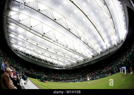 The new roof on court number one is closed during the Donna Vekic and Alison Riske match on day two of the Wimbledon Championships at the All England Lawn Tennis and Croquet Club, Wimbledon. Stock Photo