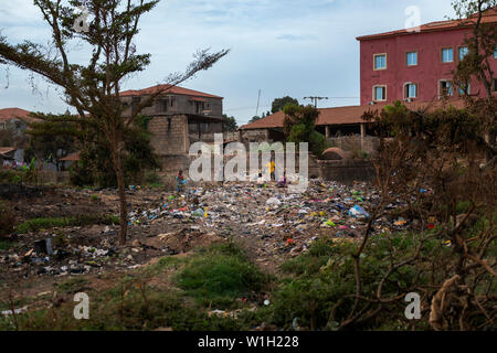 Bissau, Republic of Guinea-Bissau - February 8, 2018: Group of children collecting garbage at a landfill in the city of Bissau, in Guinea-Bissau, West Stock Photo