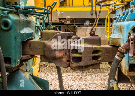 Rusty couplings coupled two trains together in the train yard Stock Photo