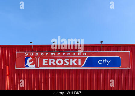 MALLORCA, SPAIN - May 6, 2019: Logo Eroski supermarket. Eroski is a Spanish supermarket chain with nearly 1,000 outlets across Spain. Stock Photo