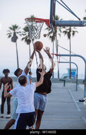 Afroamerican people playing basketball game in Venice Beach, Los Angeles, California, USA Stock Photo