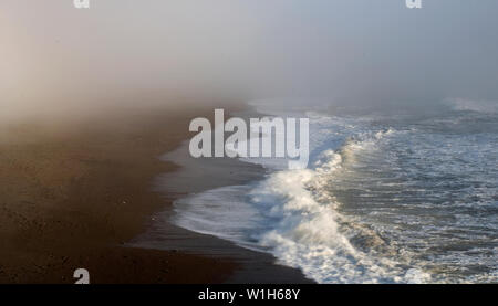 Wave crash through the fog onto Rodeo Beach in the Golden Gate Recreation Area in the Marin Headlands north of San Francisco. (c) 2009 Tom Kelly Stock Photo