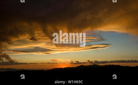 The sun sets over the Wasatch Mountains from in Tollgate Canyon near Park City, Utah. (c) 2009 Tom Kelly Stock Photo