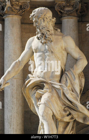 The beautiful Trevi Fountain is a centerpiece of Roman art culture. This statue of the God of Water, Oceanus, is the primary figure. Stock Photo