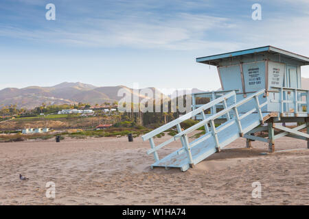 Empty Lifeguard tower marked with a sign saying, Lifeguard off duty keep off . On Zuma Beach California USA Stock Photo