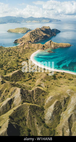 Aerial vertical view of Padar island in Komodo National Park, Indonesia. Drone shot, top view. 16:9 for phone screen saver wallpaper. Nature backgroun Stock Photo