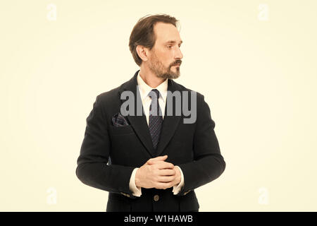 Suit imbue sense of confidence of gentlemen. Man handsome confident mature fashion model wear fashionable suit on white background. Ways to accessorize your suit. Bespoke suit flatters every wearer. Stock Photo