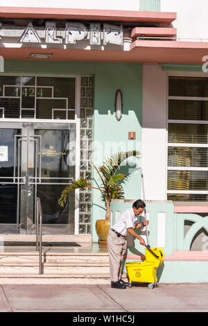 Miami Beach Florida,Ocean Drive,Art Deco Historic District,Hispanic man men male,janitor,working,work,employee worker workers staff,cleaning,mop bucke Stock Photo