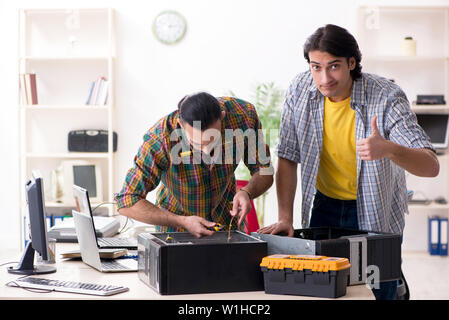 IT engineers working on hardware issue Stock Photo