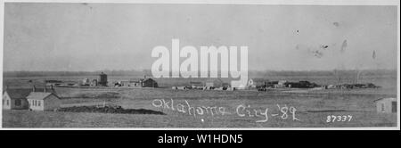 Oklahoma City, Indian. Terr., in 1889 showing U.S. Government dwellings, water tank, railroad station, hotel, post office and store, stage stables, tents of 13th Infantry detachment guarding lumber and an uncompleted cemetery Stock Photo