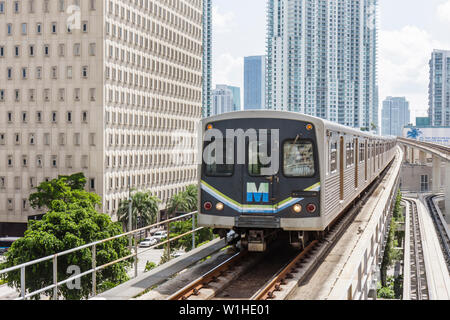 Miami Florida,Government Center Metrorail Station,mass transit,elevated track,train,downtown skyline,office buildings,city skyline,FL091015010 Stock Photo