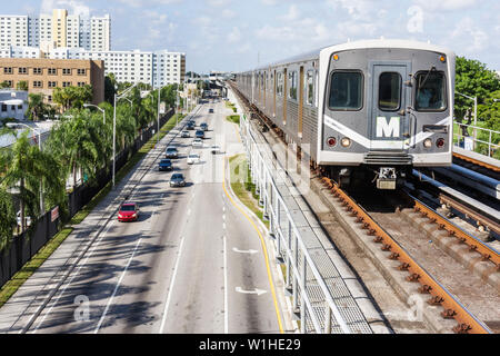 Miami Florida,Civic Center Metrorail Station,NW 12th Avenue,mass transit,elevated rail system,train,street,traffic,car,FL091015018