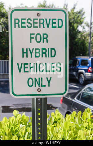 Naples Florida,Hilton DoubleTree Guest Suites,parking lot,sign,reserved space,hybrid vehicles only,Green movement,conservation,FL091018130 Stock Photo