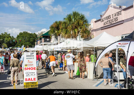Mt. Mount Dora Florida,Annual Craft Fair,special community,street festival,vendor vendors,stall stalls booth market buying selling,tent,shoe sale,crow Stock Photo