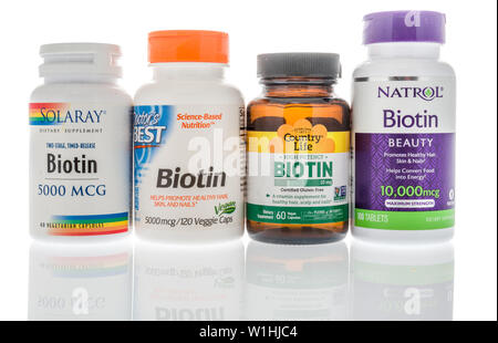 Winneconne, WI - 27 May 2019 : A collection of biotin supplements on an isolated background Stock Photo