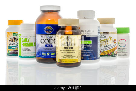 Winneconne, WI - 27 May 2019 : A collection of Mens multi-vitamin supplements on an isolated background Stock Photo