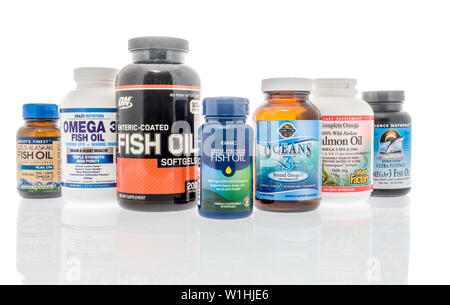 Winneconne, WI - 27 May 2019 : A collection of  Fish oil supplements on an isolated background Stock Photo