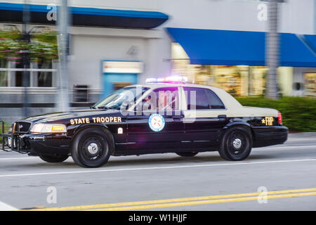 Miami Beach Florida,41st Street,Arthur Godfrey Road,State Trooper,FHP,Florida Highway Patrol,car,vehicle,emergency lights,police,officer,public safety Stock Photo