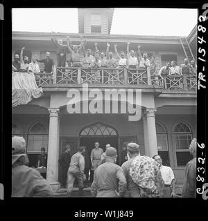 Scores of allied prisoners were released by Navy and Marine Corp men at Saitama prefecture, a Franciscan convent 30 miles North of Tokyo used as a prison during the war. Allied prisoners cheer as liberators come to free them. Stock Photo