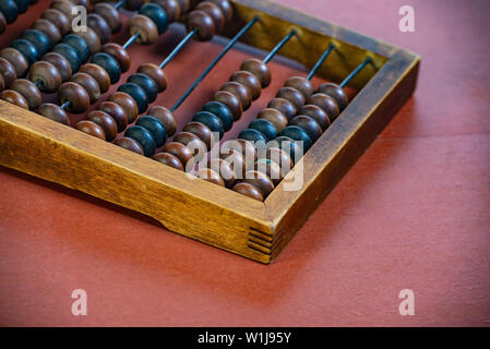 Vintage wooden abacus close up. Fragment of old abacus close up. Stock Photo