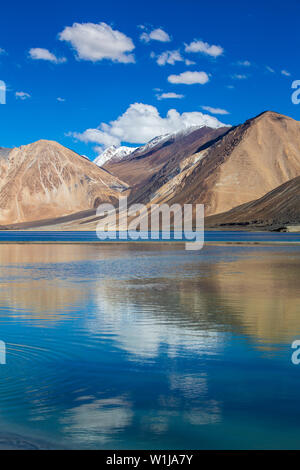 View of majestic rocky mountains against the blue sky and lake Pangong in Indian Himalayas, Ladakh region, Jammu and Kashmir, India. Nature and travel Stock Photo