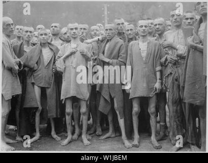 Starved prisoners, nearly dead from hunger, pose in concentration camp in Ebensee, Austria. The camp was reputedly used for scientific experiments. It was liberated by the 80th Division.; General notes:  Use War and Conflict Number 1103 when ordering a reproduction or requesting information about this image. Stock Photo