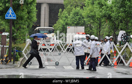 Police officers stand guard around the Imperial Hotel Osaka in Osaka, Japan on June 27, 2019. Credit: AFLO/Alamy Live News Stock Photo