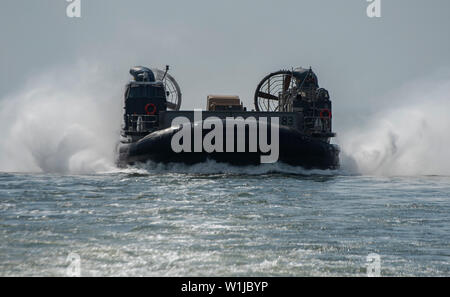 190520-N-FA806-0075  ATLANTIC OCEAN (May 20, 2019) A landing craft, air cushion, assigned to Assault Craft Unit 4 (ACU 4), enters the well deck of the San Antonio-class amphibious transport dock ship USS New York (LPD 21). New York is currently underway heading to Fleet Week New York. (U.S. Navy Photo by Mass Communication Specialist 3rd Class Roland John/Released) Stock Photo