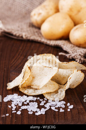 Potato chips. Starter with potatoes. Addition to beer. Salty snacks. Stock Photo