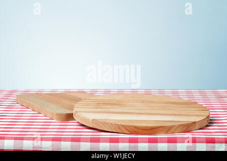 Wooden board with a napkin on a table Stock Photo