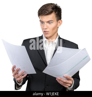 Busy businessman with loads of paperwork Stock Photo