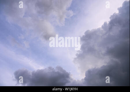 Rain clouds moving through the purity purple sky Stock Photo