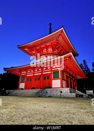 The vibrant red Konpon Daito Pagoda in the Unesco listed Danjo Garan shingon buddhism temple complex in Koyasan, Wakayama, Japan. A famous pilgrimage. Stock Photo