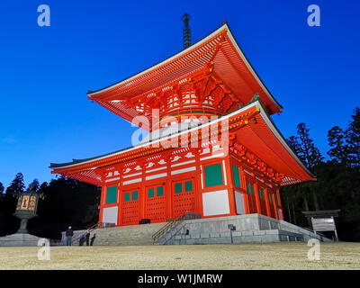 The vibrant red Konpon Daito Pagoda in the Unesco listed Danjo Garan shingon buddhism temple complex in Koyasan, Wakayama, Japan. A famous pilgrimage. Stock Photo