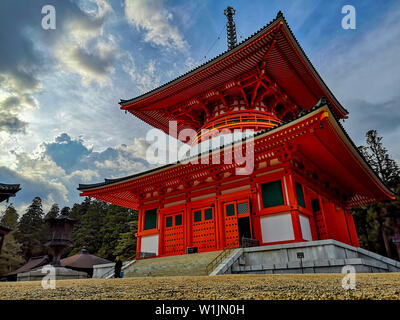 The vibrant red Konpon Daito Pagoda in the Unesco listed Danjo Garan shingon buddhism temple complex in Koyasan, Wakayame, Japan. Stock Photo