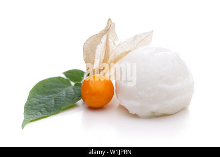 A scoop of lemon ice cream decorated with physalis and leaves isolated on white background Stock Photo