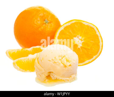 orange ice cream scoop in front of whole orange and a slice of orange isolated on white background Stock Photo