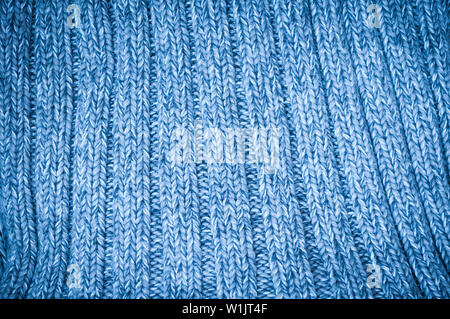 abstract blue background with a knitted fabric.  Knitted woolen background Stock Photo