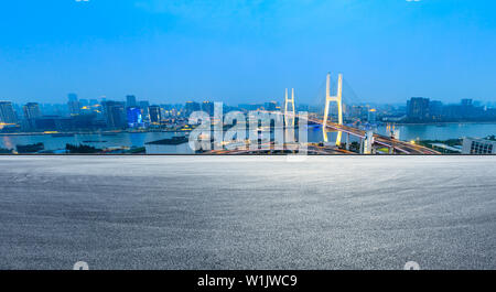 Empty road and Nanpu bridge at night in Shanghai,China Stock Photo