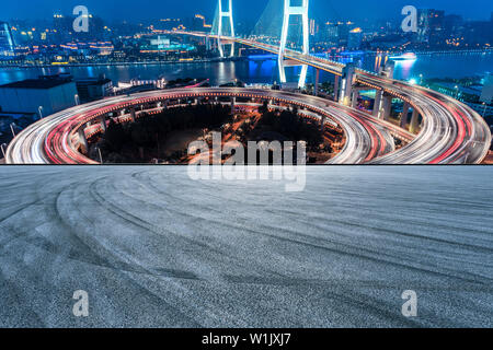 Empty road and Nanpu bridge at night in Shanghai,China Stock Photo