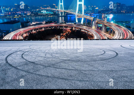 Empty road and Nanpu bridge at night in Shanghai,China Stock Photo