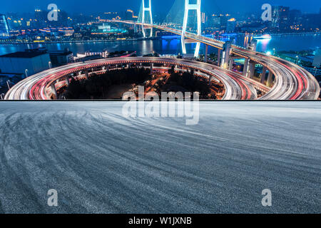 Empty road and Nanpu bridge at night in Shanghai,China Stock Photo